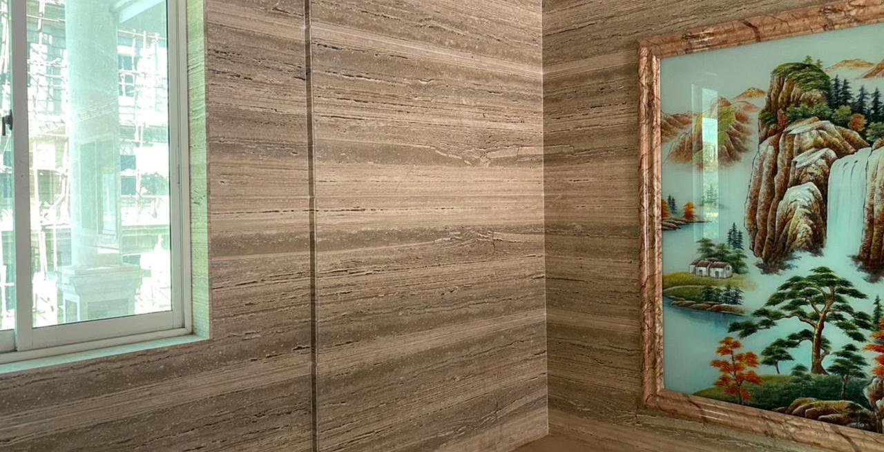 Interior feature wall finished with aligned decorative tiles
