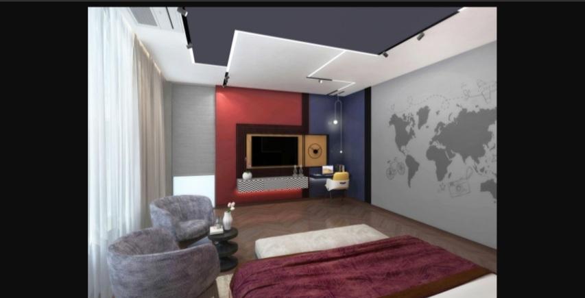 Bedroom featuring a layered gypsum tray ceiling