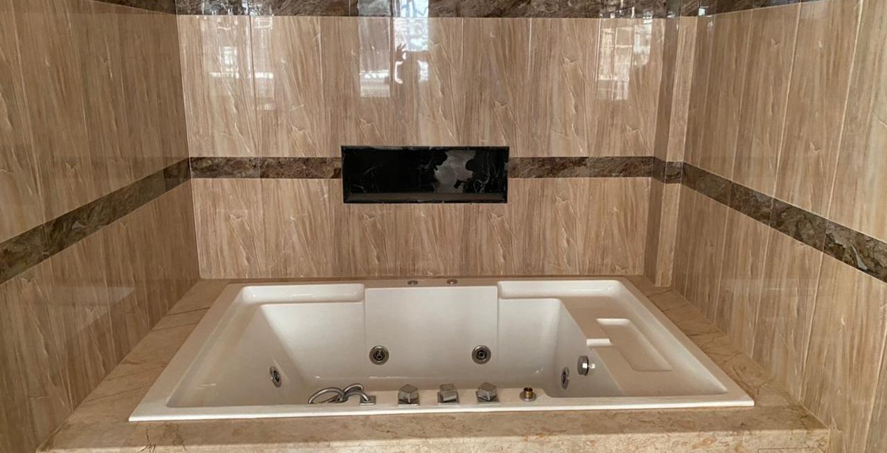 Stone tiled bath surround